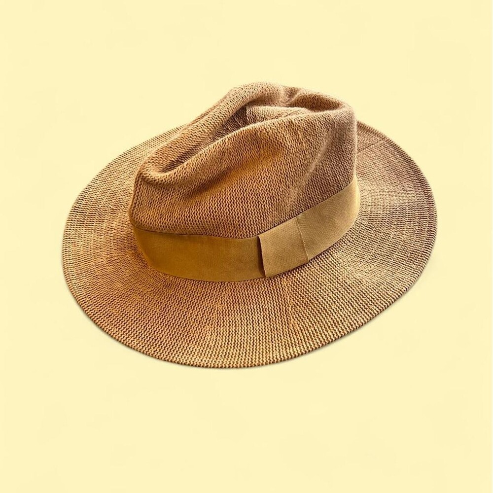 Tan straw fedora with a wide brim and a suede band. #western #boho